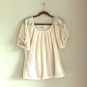 Sheer-sleeved cream blouse with polka dots